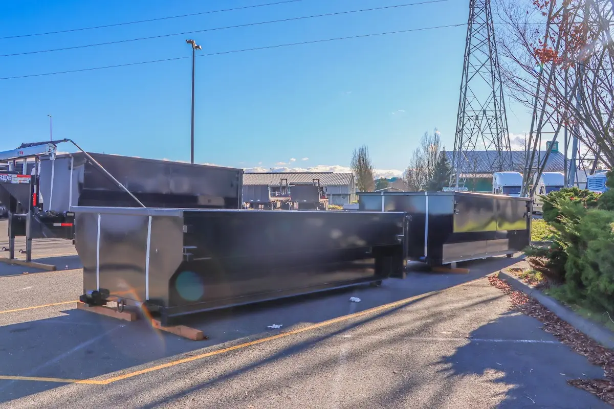 Roll-off dumpster ready for waste disposal at job site for 12 Yard Dumpster Rental in Spring Lake